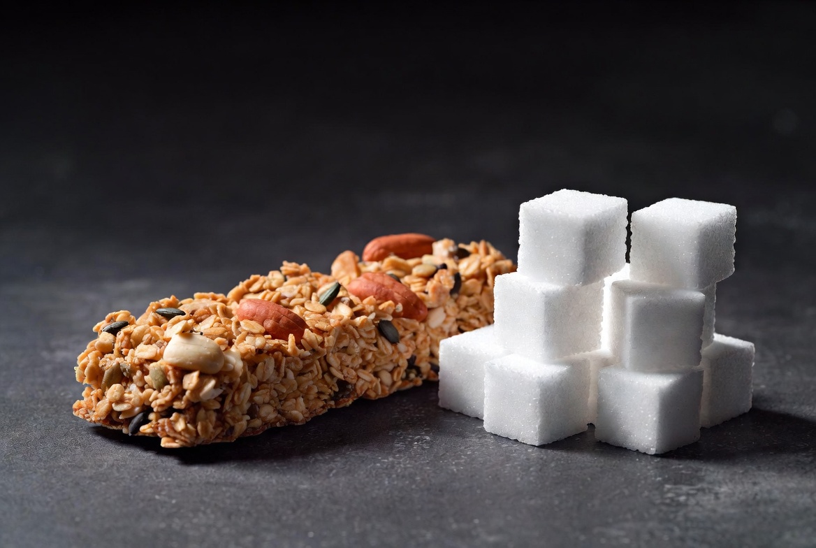 Granola bar next to its sugar cube equivalent