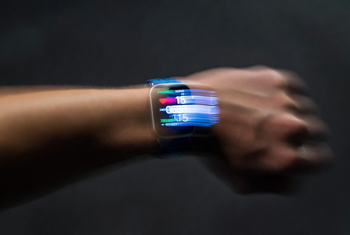 Wrist wearing fitness tracker during active workout